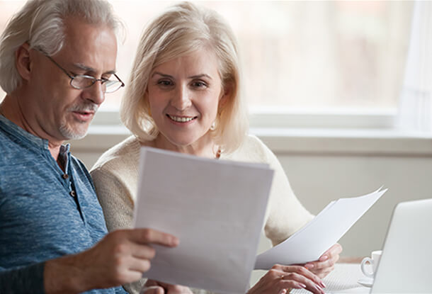 Older couple discussing financial documents